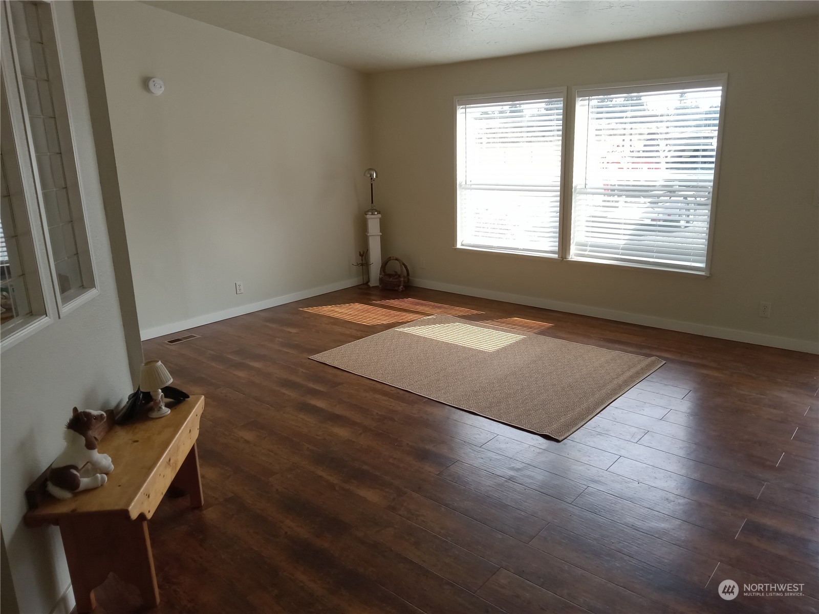 19721 Carper Road Southwest Rochester, WA 98579 - Photo 5 of 9 a view of an empty room with wooden floor and a window