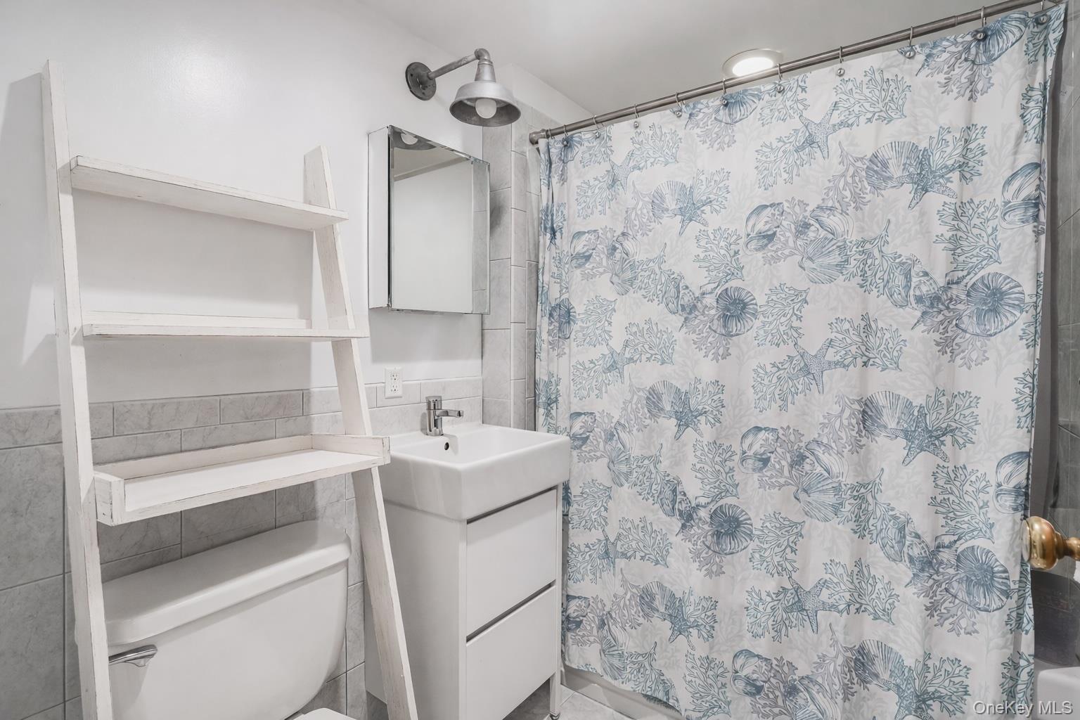 33 Milltown Road Brewster, NY 10509 - Photo 12 of 30 a bathroom with a sink toilet and shower