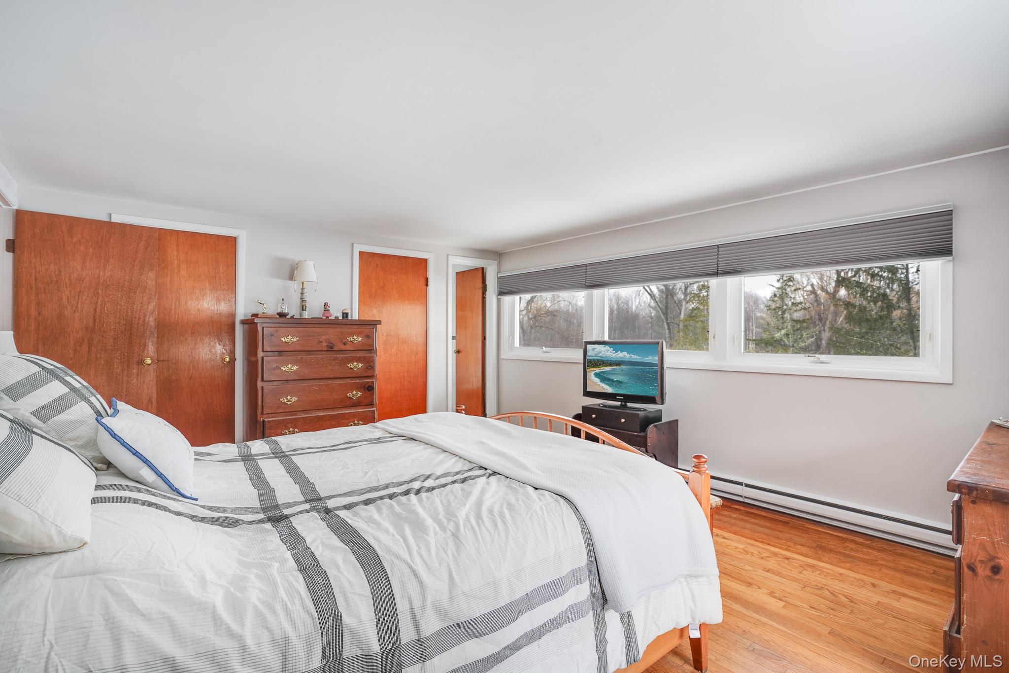 33 Milltown Road Brewster, NY 10509 - Photo 14 of 30 a bed sitting in a bedroom next to a window