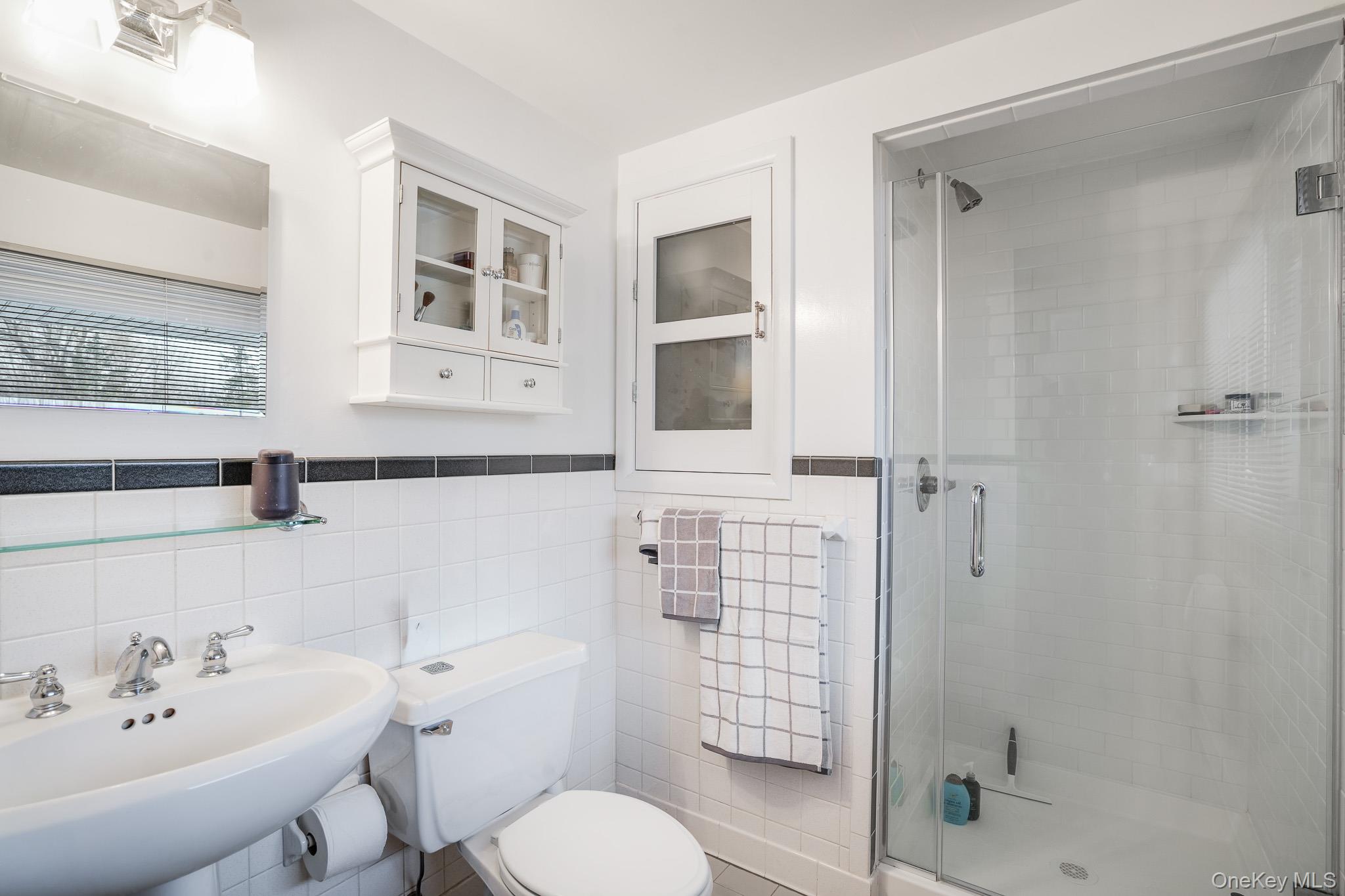 33 Milltown Road Brewster, NY 10509 - Photo 15 of 30 a bathroom with a toilet sink and shower