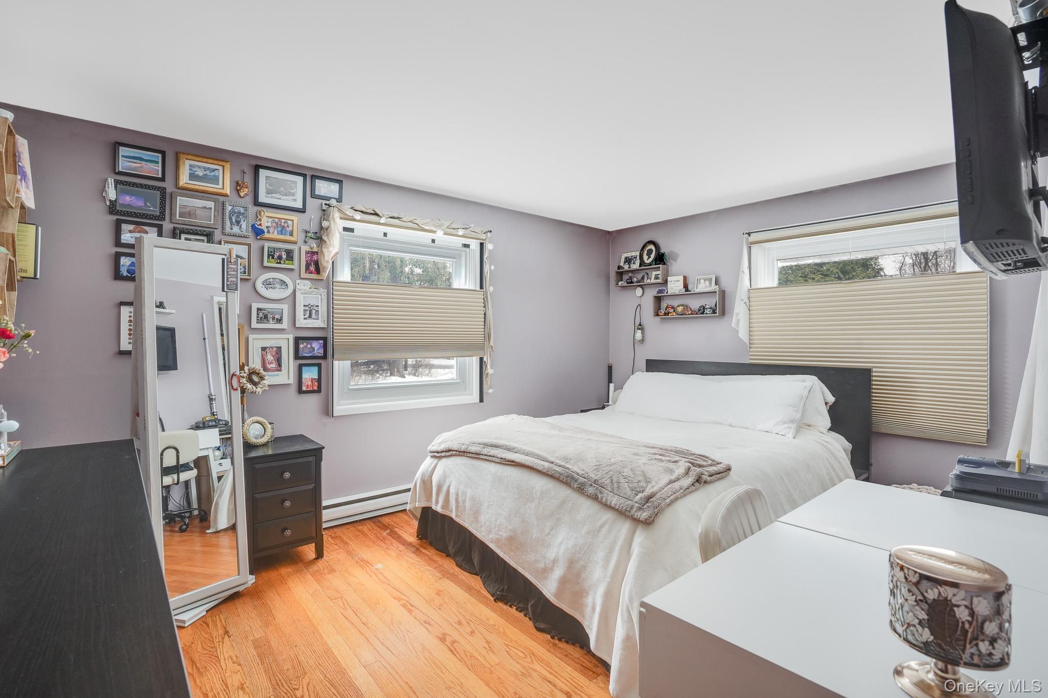 33 Milltown Road Brewster, NY 10509 - Photo 16 of 30 a bedroom with a bed and a tv on table