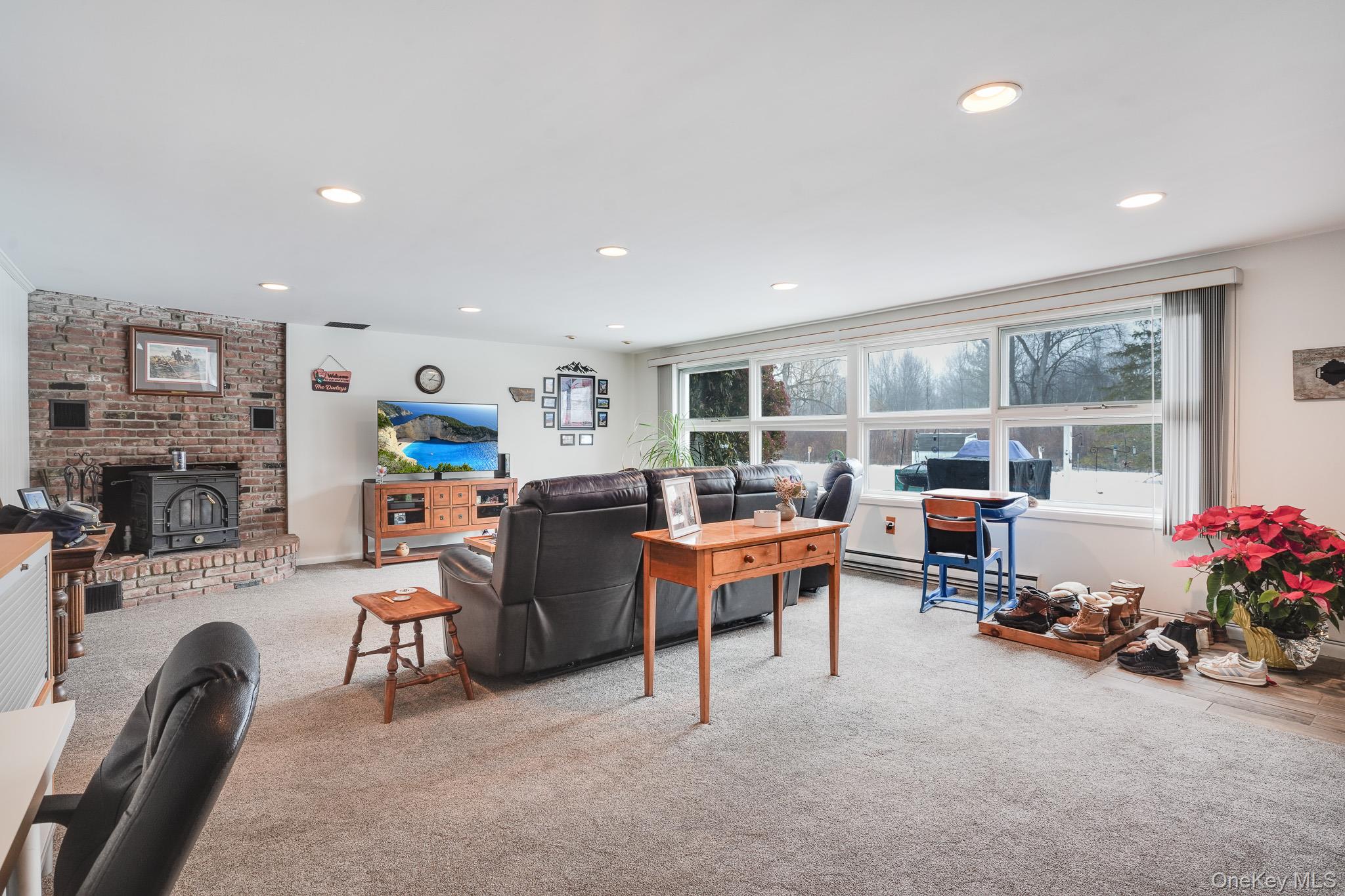 33 Milltown Road Brewster, NY 10509 - Photo 21 of 30 a living room with furniture and a garage