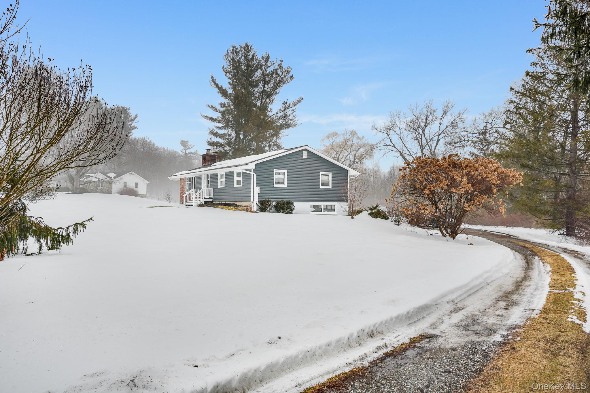 33 Milltown Road Brewster, NY 10509 - Photo 26 of 30 a view of houses with snow on the road