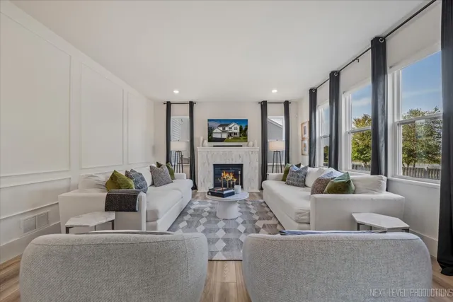 a living room with furniture and a fireplace