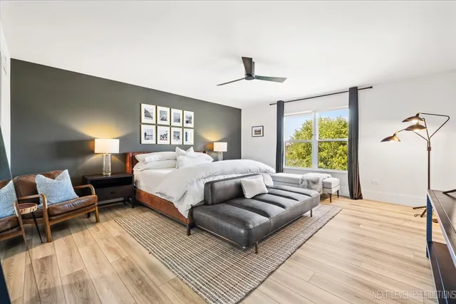 a bedroom with a large bed and a window