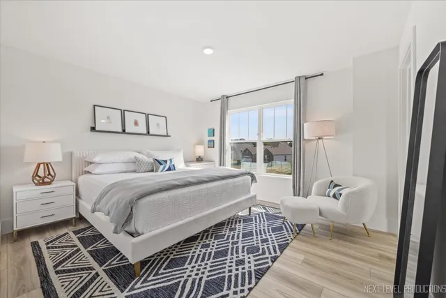 a bedroom with a bed and a mirror