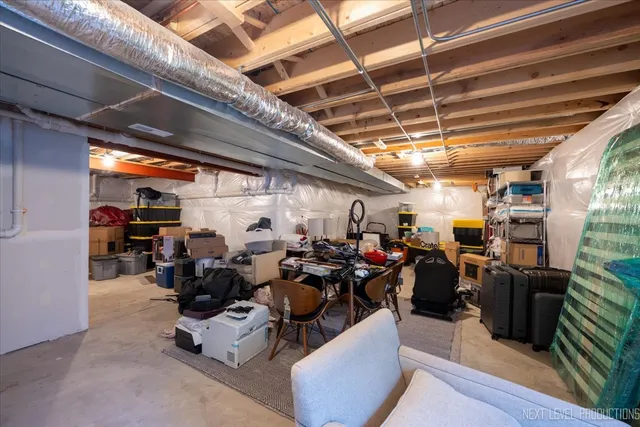 a living room with lots of furniture and a chandelier