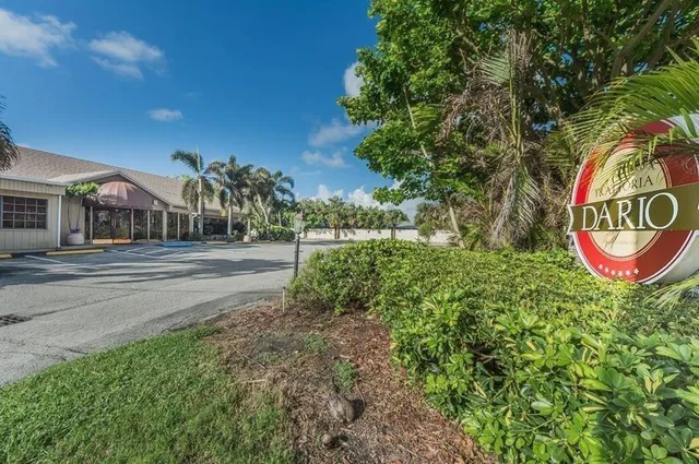 a view of a street with a building in the background