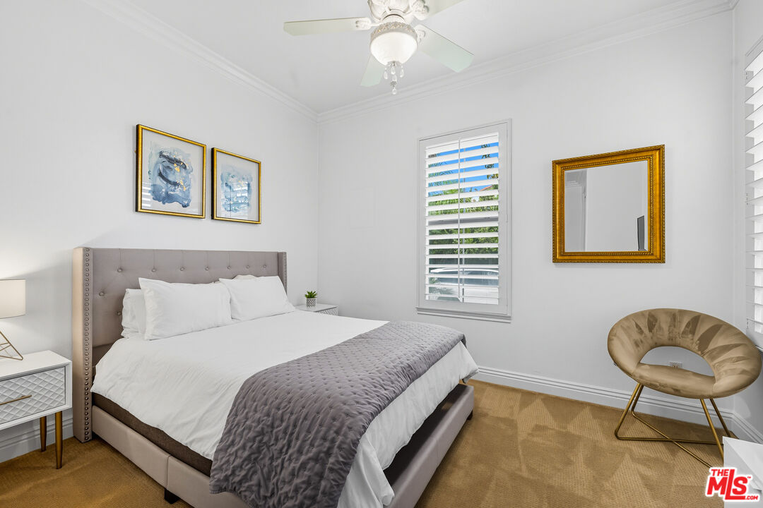 22074 Sagebrook Road Chatsworth, CA 91311 - Photo 20 of 35 a bedroom with a bed and a chair