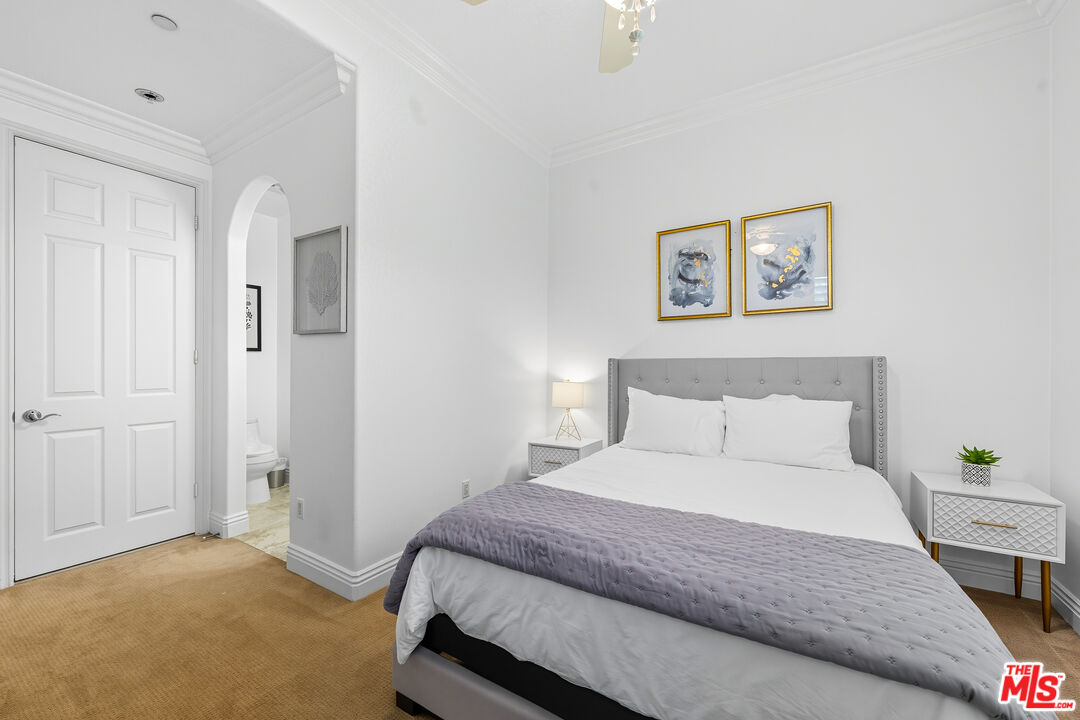 22074 Sagebrook Road Chatsworth, CA 91311 - Photo 21 of 35 a bedroom with a bed and a painting on the wall