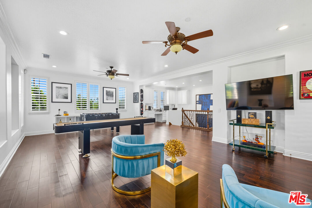 22074 Sagebrook Road Chatsworth, CA 91311 - Photo 24 of 35 a living room with furniture and a flat screen tv