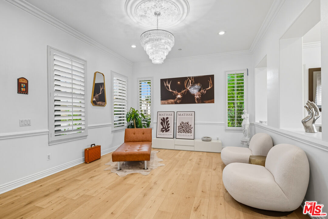 22074 Sagebrook Road Chatsworth, CA 91311 - Photo 3 of 35 a living room with furniture a fireplace and a flat screen tv