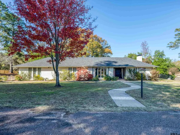a view of a big yard next to a house