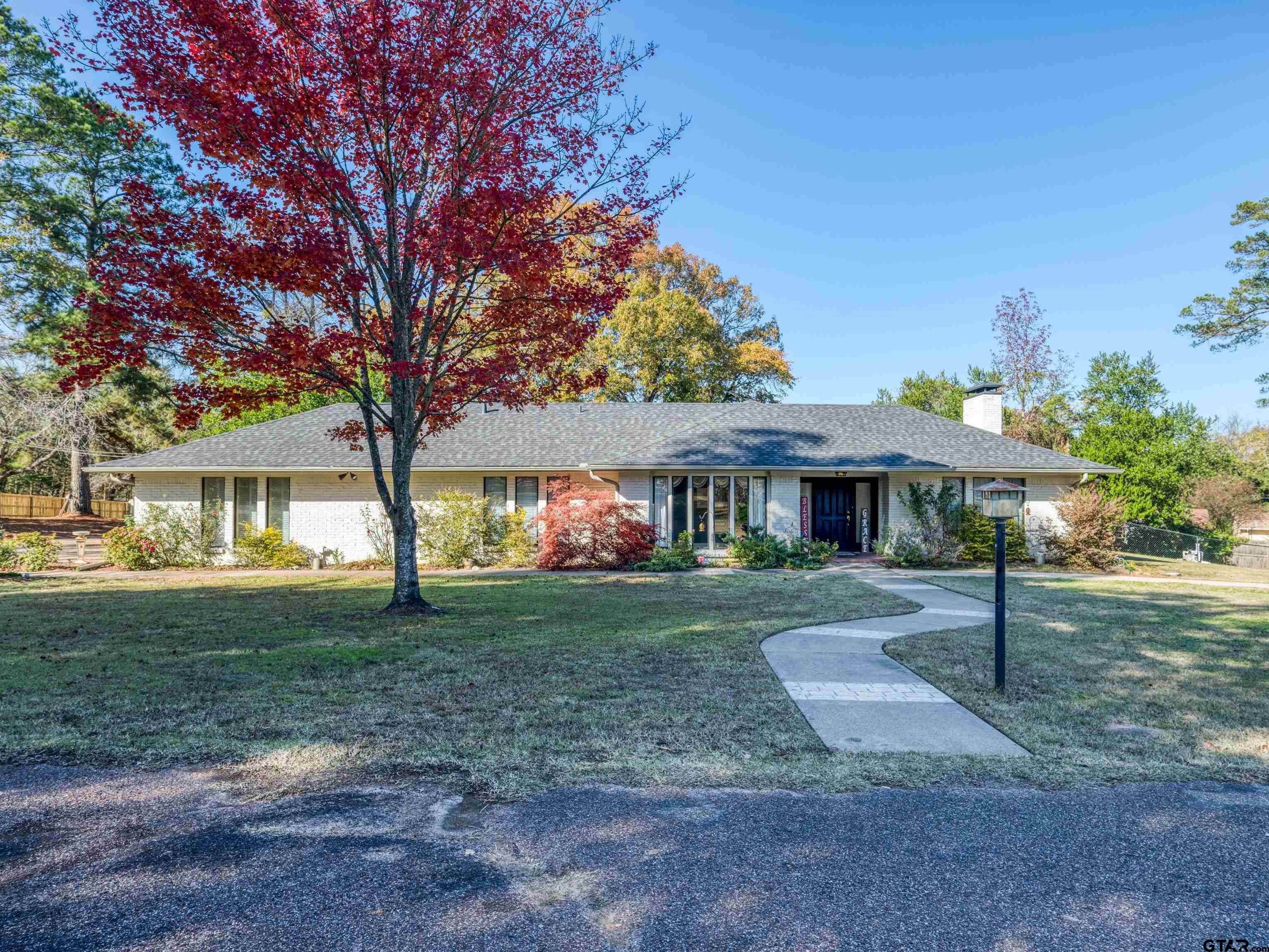a view of a big yard next to a house