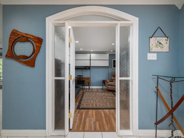 a view of a hallway with a living room
