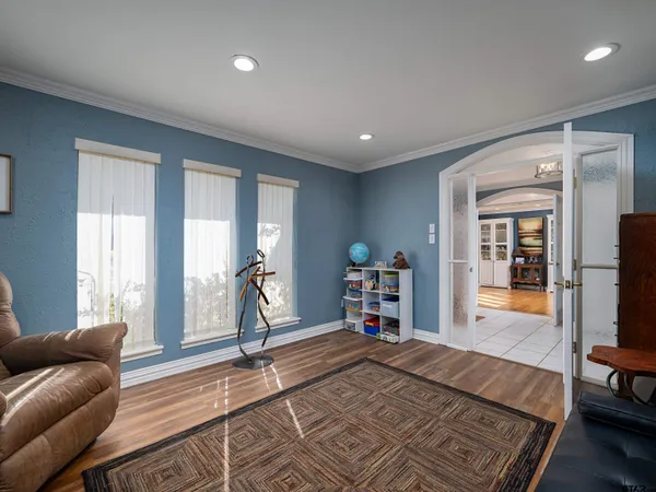 a bedroom with furniture and a window