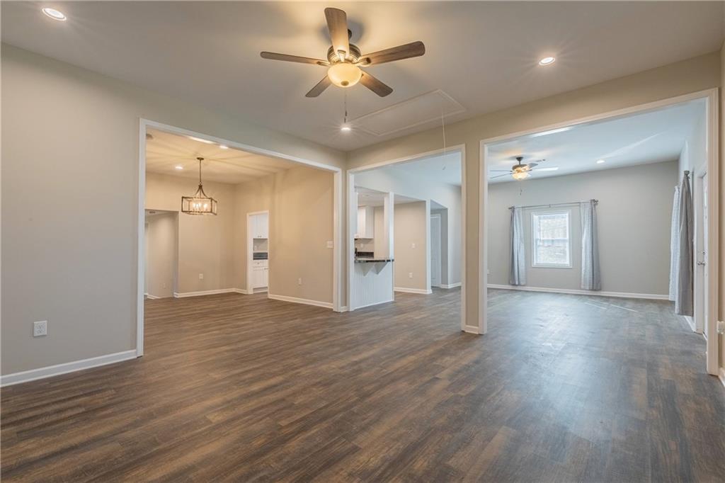 3107 Hendrix Circle Southwest Covington, GA 30014 - Photo 17 of 66 a view of an empty room with window and wooden floor