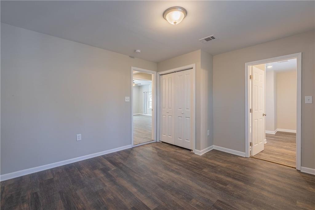 3107 Hendrix Circle Southwest Covington, GA 30014 - Photo 41 of 66 an empty room with wooden floor & windows