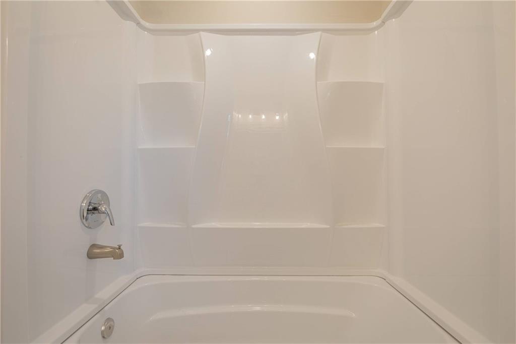 3107 Hendrix Circle Southwest Covington, GA 30014 - Photo 42 of 66 a close up of a bathtub