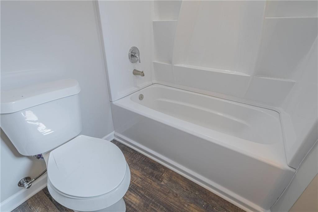 3107 Hendrix Circle Southwest Covington, GA 30014 - Photo 56 of 66 a bathroom with a toilet and a bathtub