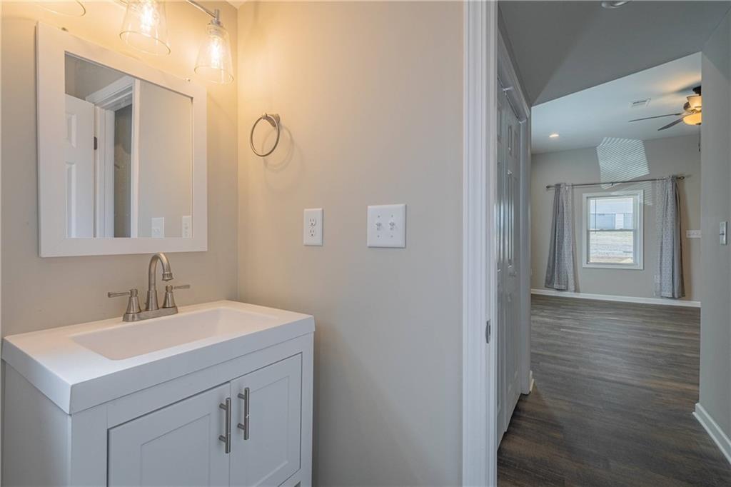 3107 Hendrix Circle Southwest Covington, GA 30014 - Photo 58 of 66 a bathroom with a sink and a mirror