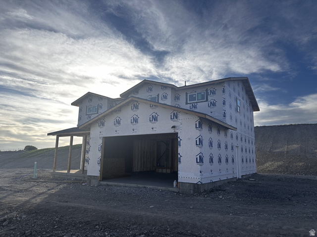 513 East Upper Cyn Road Smithfield, UT 84335 - Photo 2 of 25 New construction framed residence featuring an attached garage, covered porch with support columns, and multiple windows