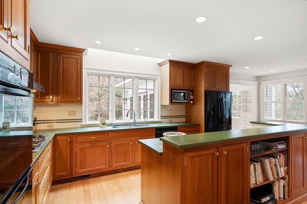 5 Powisset Street Dover, MA 02030 - Photo 14 of 41 a kitchen with stainless steel appliances granite countertop a sink stove and refrigerator