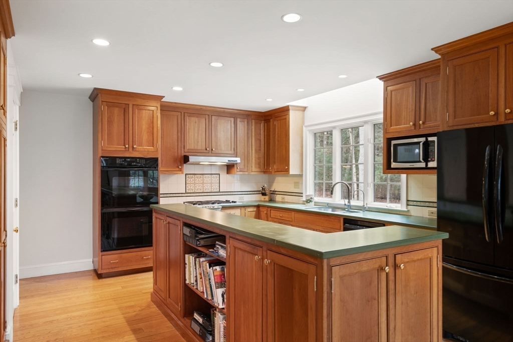 5 Powisset Street Dover, MA 02030 - Photo 15 of 41 a kitchen with a sink stove top oven and refrigerator