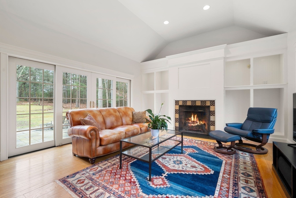 5 Powisset Street Dover, MA 02030 - Photo 17 of 41 a living room with furniture and a fireplace
