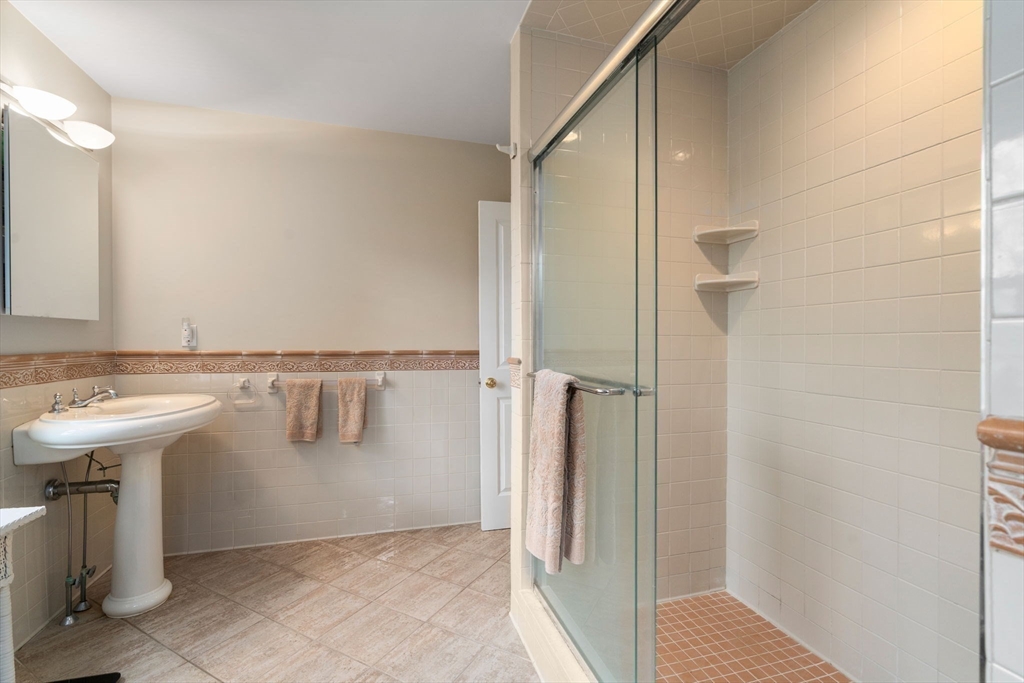 5 Powisset Street Dover, MA 02030 - Photo 25 of 41 a bathroom with a sink and mirror