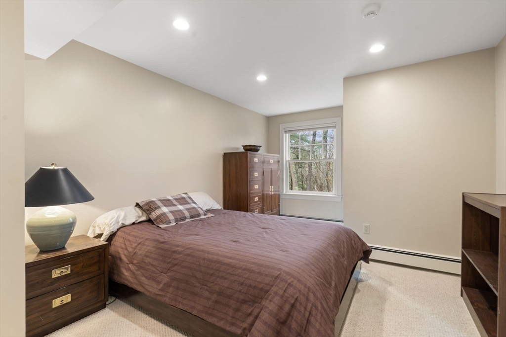 5 Powisset Street Dover, MA 02030 - Photo 29 of 41 a bedroom with a bed and a television