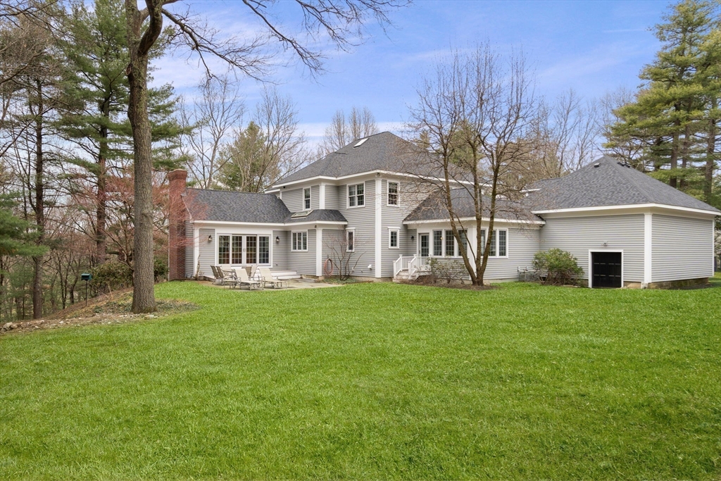 5 Powisset Street Dover, MA 02030 - Photo 3 of 41 a view of a house with a big yard and large trees