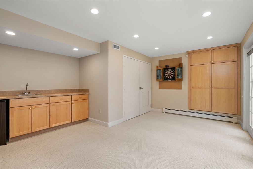 5 Powisset Street Dover, MA 02030 - Photo 32 of 41 a view of an empty room with a kitchen