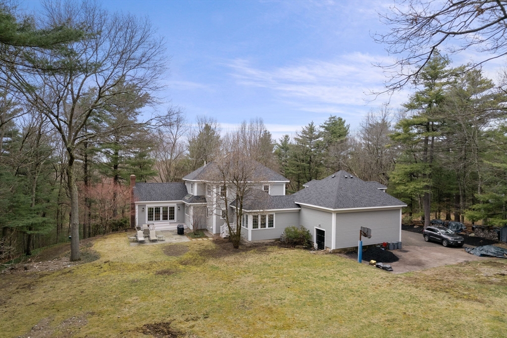 5 Powisset Street Dover, MA 02030 - Photo 37 of 41 a view of a house with a yard