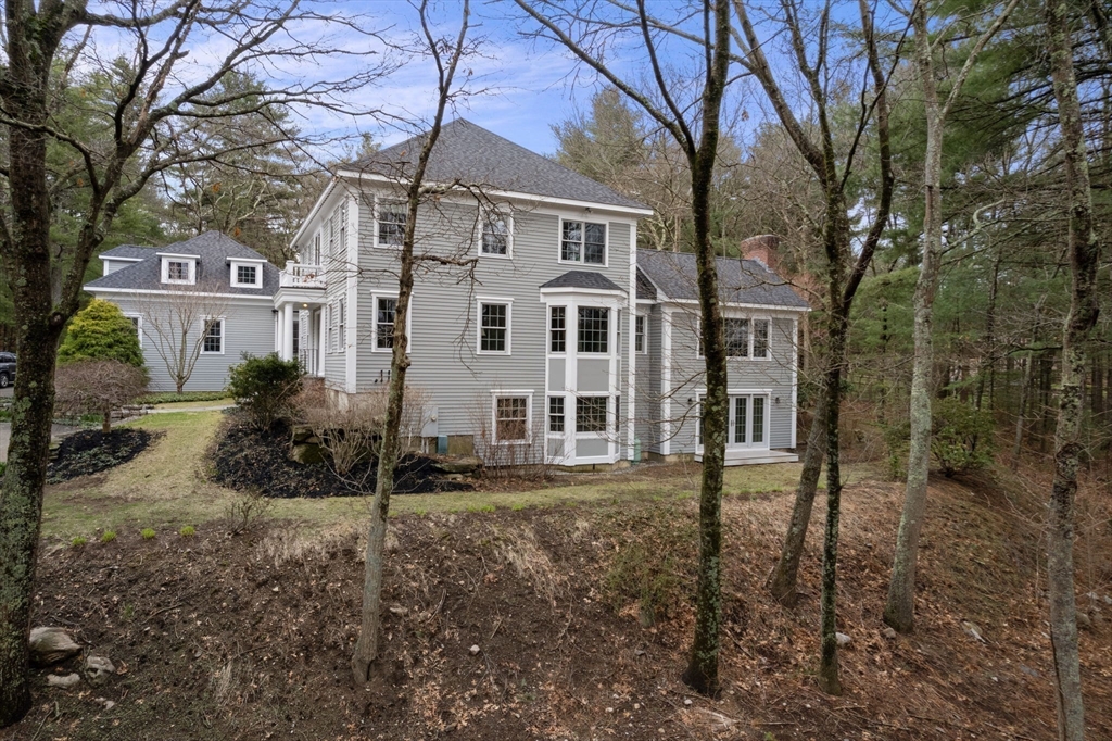 5 Powisset Street Dover, MA 02030 - Photo 39 of 41 a front view of a house with a yard