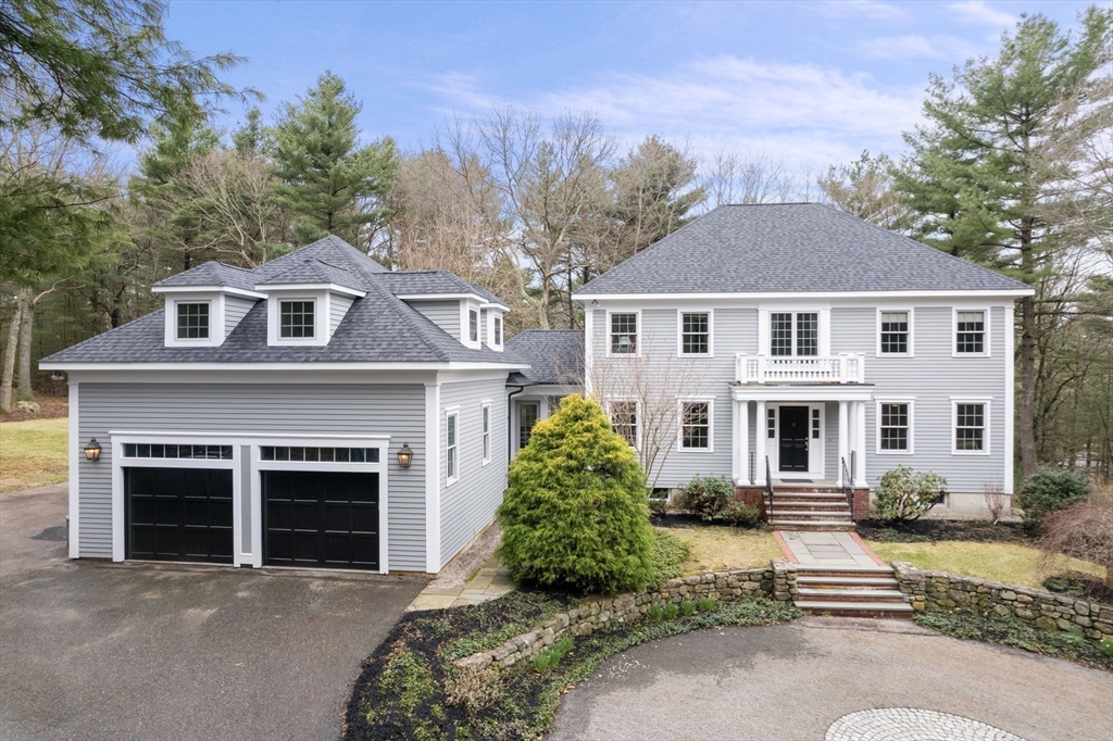5 Powisset Street Dover, MA 02030 - Photo 4 of 41 a front view of a house with a yard