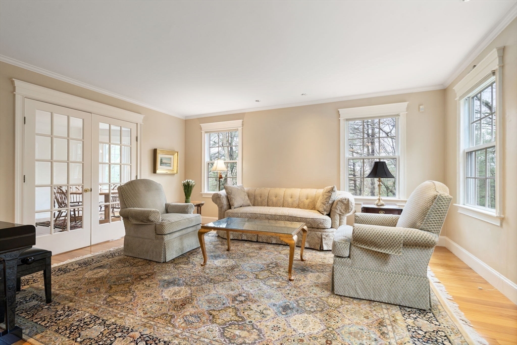 5 Powisset Street Dover, MA 02030 - Photo 10 of 41 a living room with furniture and large windows