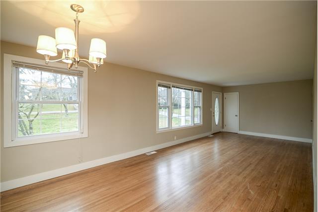 Spacious living and dining. Noticed the refinished hardwoods.