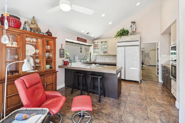 a bedroom with a bed and a couch