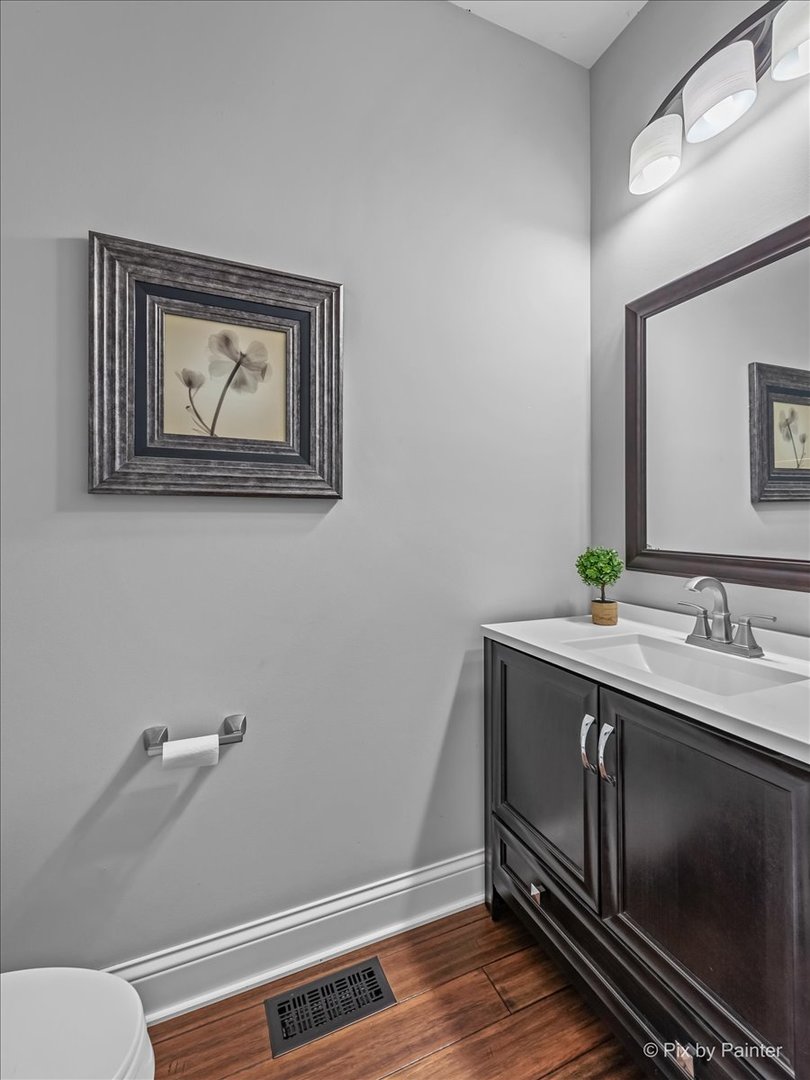 313 Market Street Genoa, IL 60135 - Photo 11 of 49 a view of room with window and wooden floor