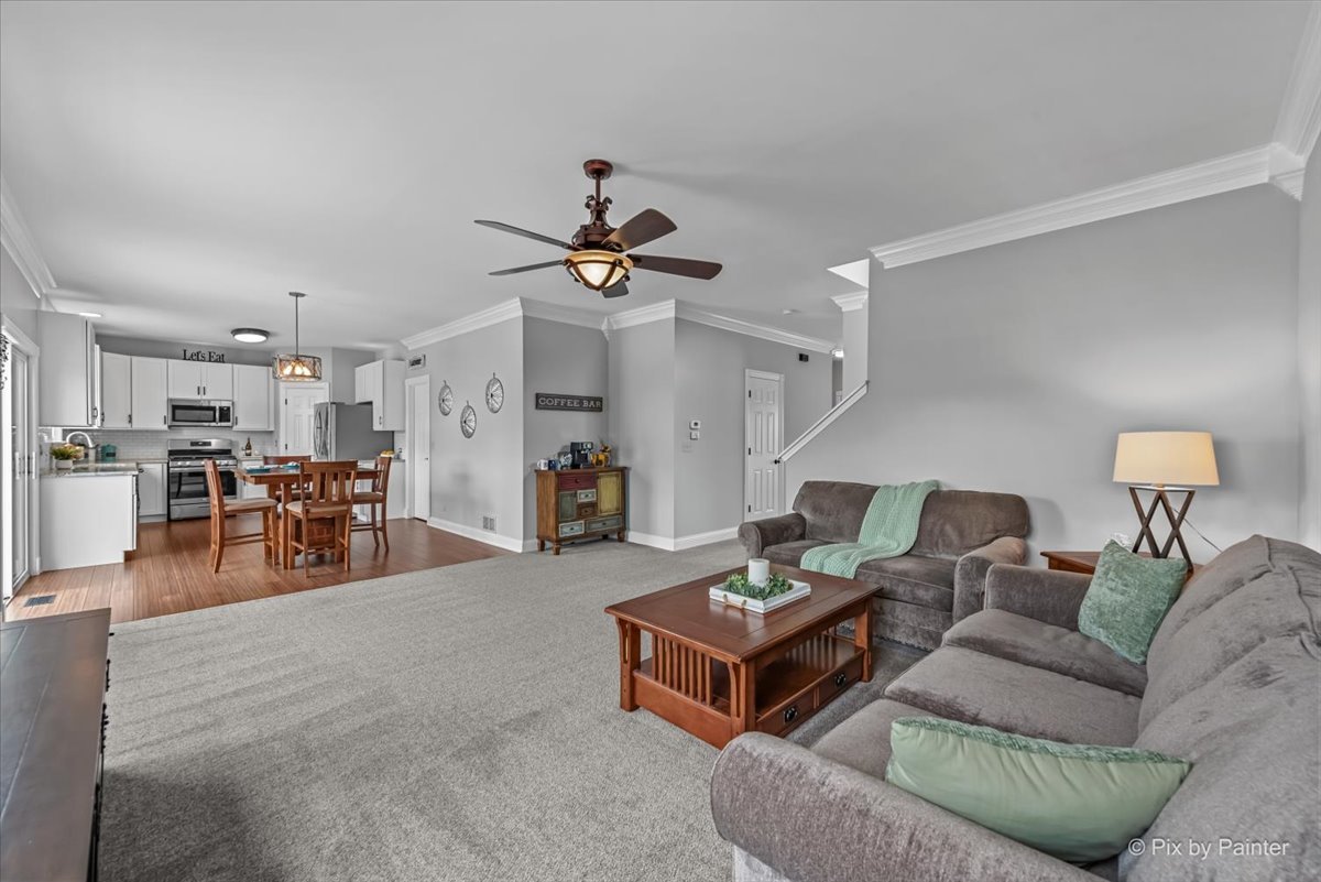 313 Market Street Genoa, IL 60135 - Photo 14 of 49 a living room with furniture and kitchen view