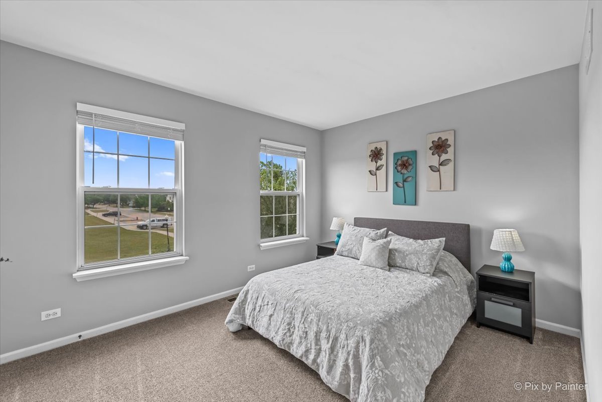 313 Market Street Genoa, IL 60135 - Photo 22 of 49 a bedroom with a bed and a window