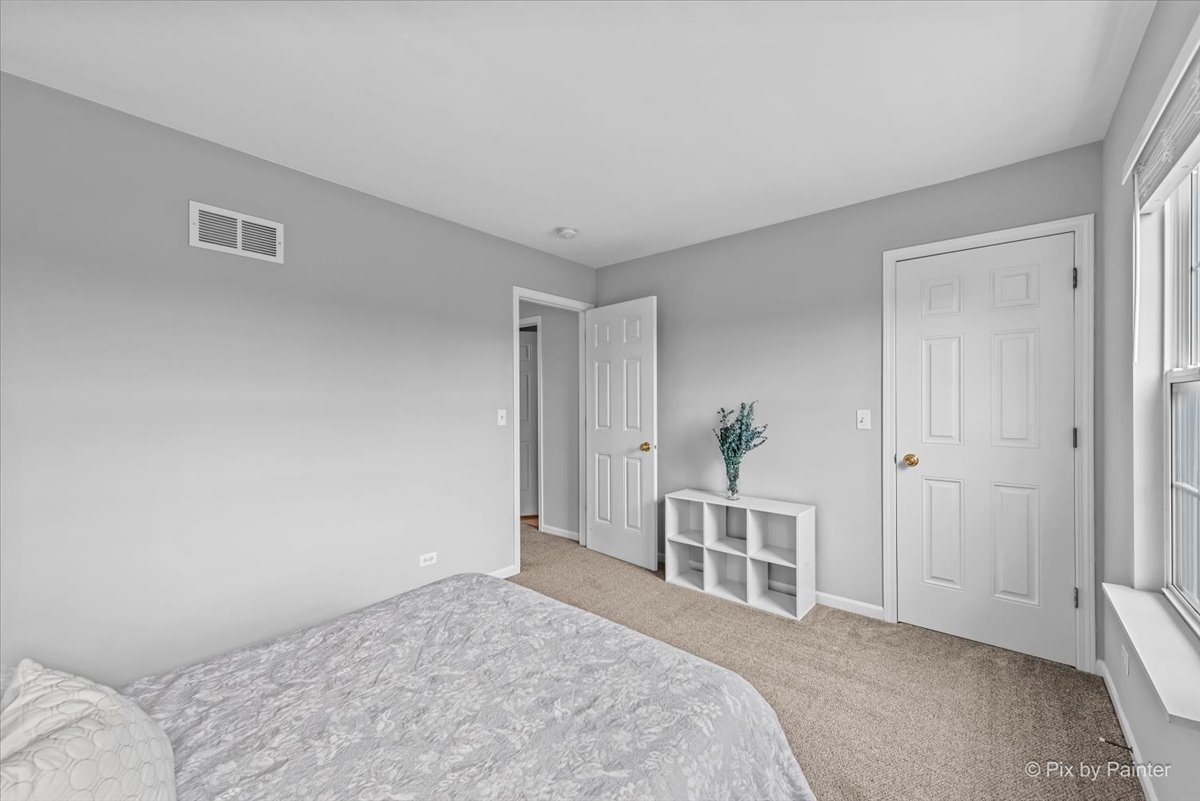 313 Market Street Genoa, IL 60135 - Photo 23 of 49 a bedroom with a bed and a window