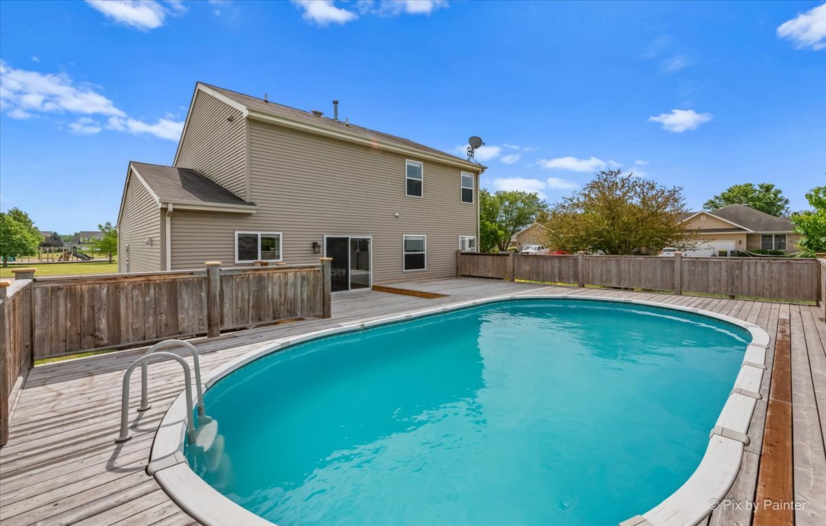 313 Market Street Genoa, IL 60135 - Photo 29 of 49 a view of a backyard with swimming pool