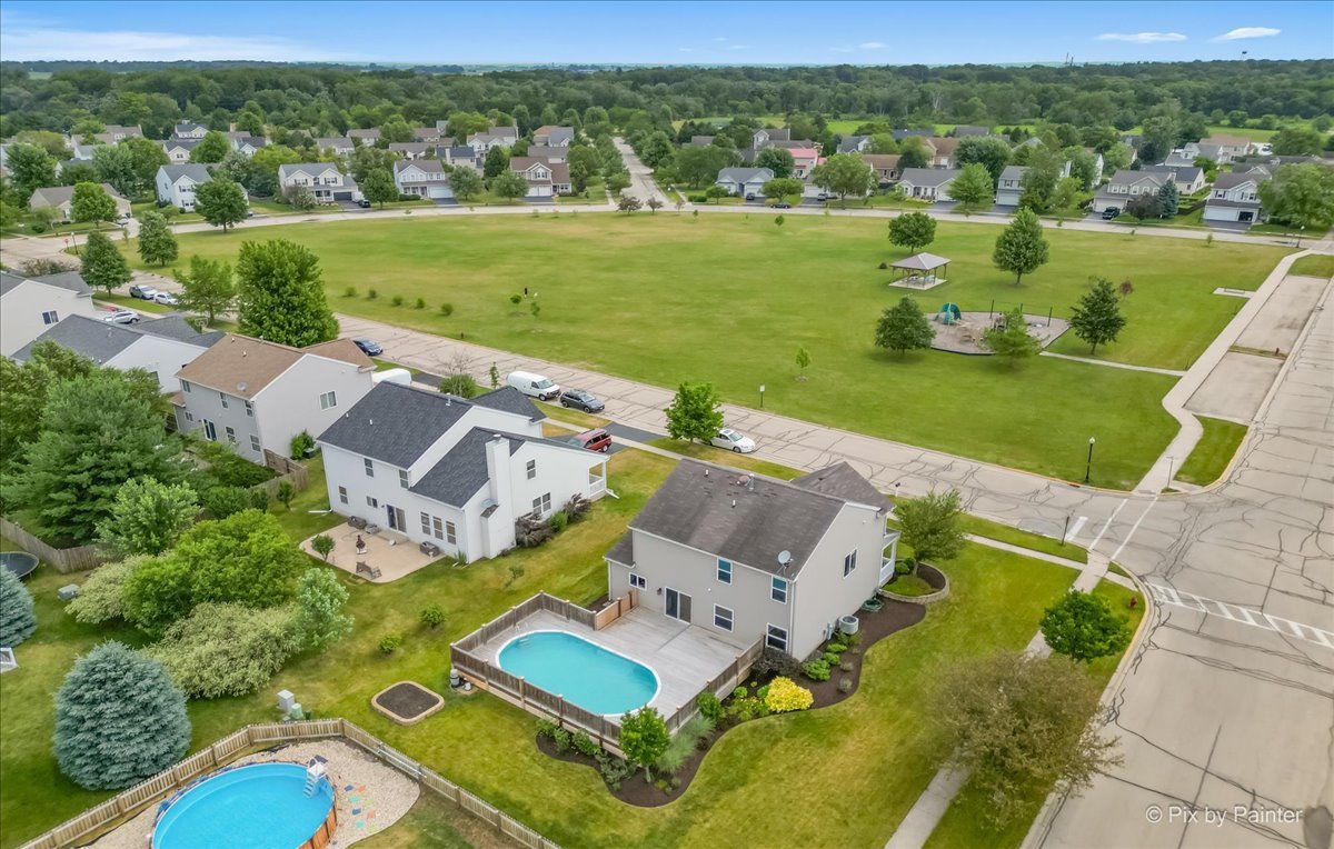 313 Market Street Genoa, IL 60135 - Photo 33 of 49 an aerial view of a house with a big yard