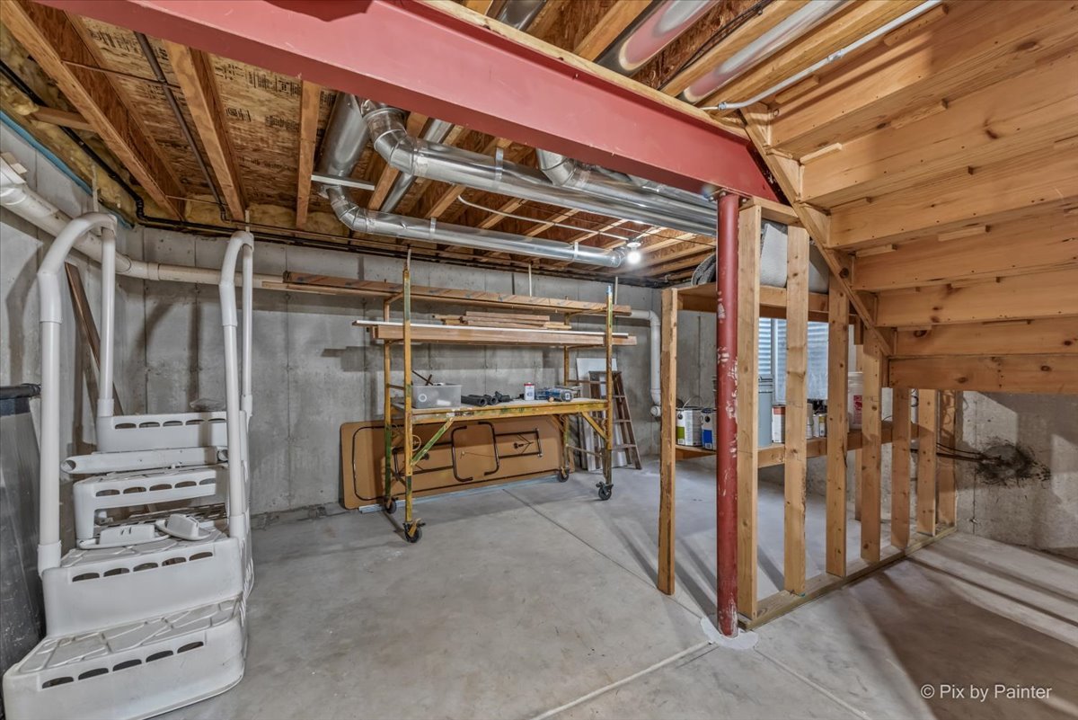 313 Market Street Genoa, IL 60135 - Photo 40 of 49 a view of an empty room with wooden floor