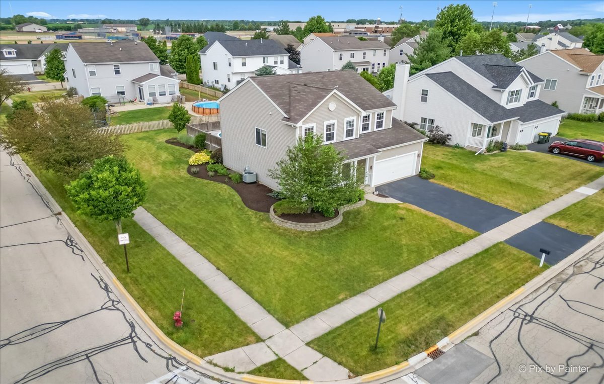 313 Market Street Genoa, IL 60135 - Photo 4 of 49 an aerial view of a house