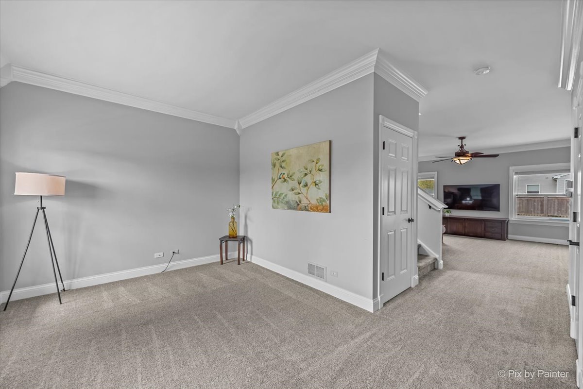 313 Market Street Genoa, IL 60135 - Photo 8 of 49 a view of a livingroom with kitchen and a sink