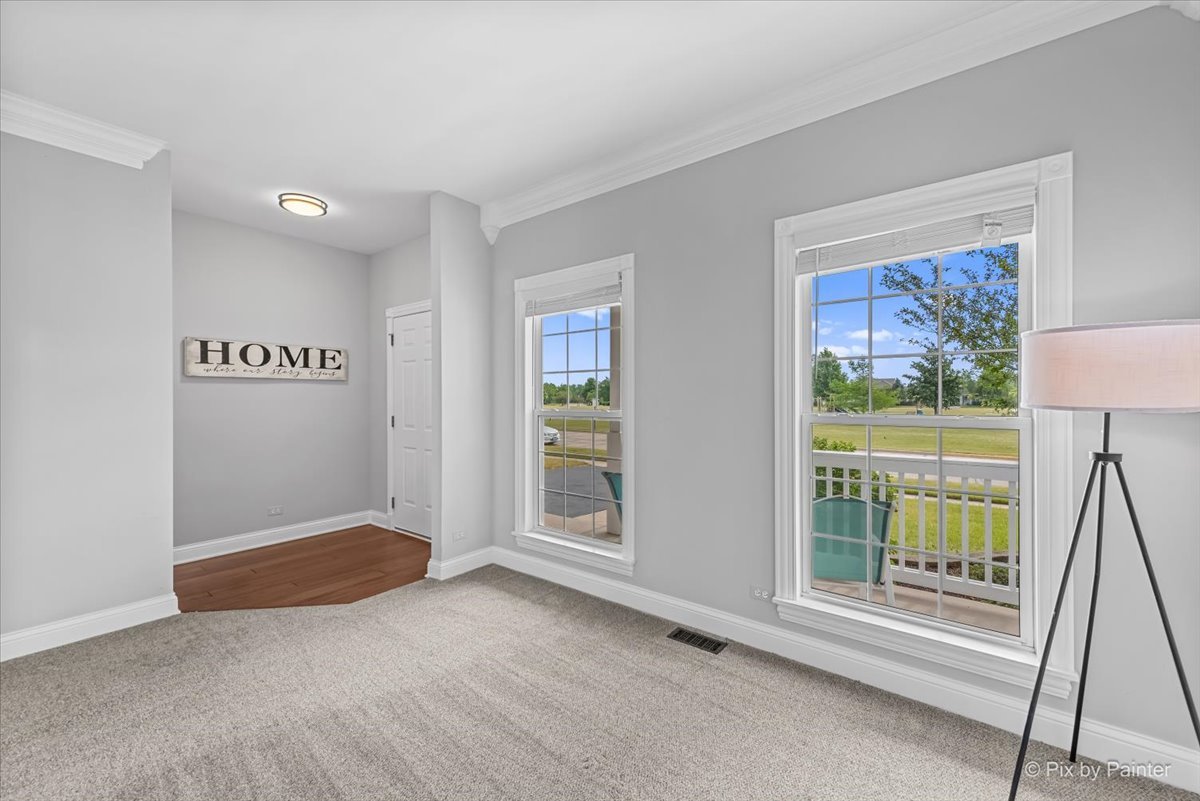 313 Market Street Genoa, IL 60135 - Photo 10 of 49 a view of an empty room with a window