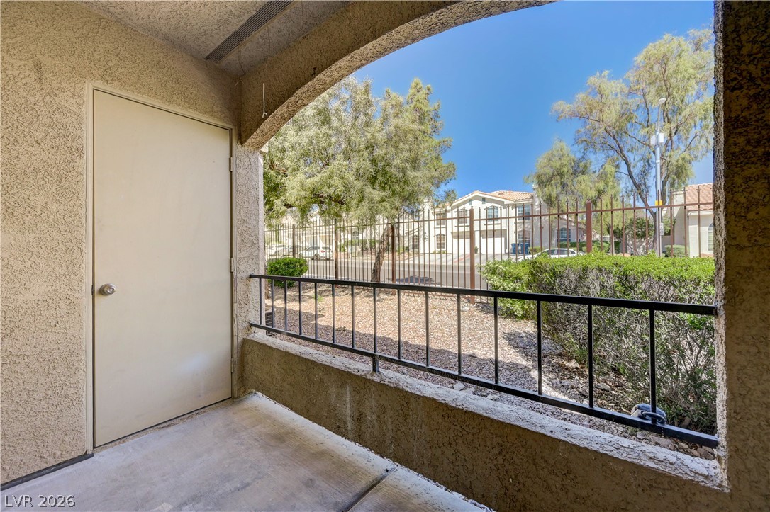 7885 West Flamingo Road, Unit 1050 Las Vegas, NV 89147 - Photo 32 of 62 A private patio with secure fencing offers an appealing outdoor area.